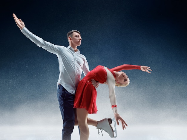 Free Photo professional man and woman figure skaters performing show or competition on ice arena