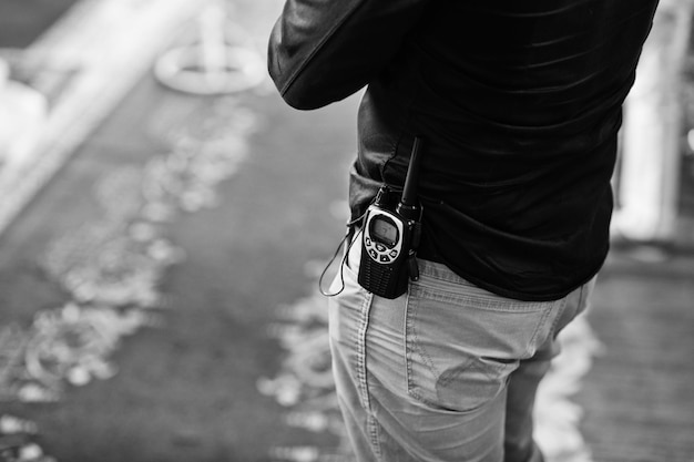 Free Photo professional walkietalkie radio in belt of security man