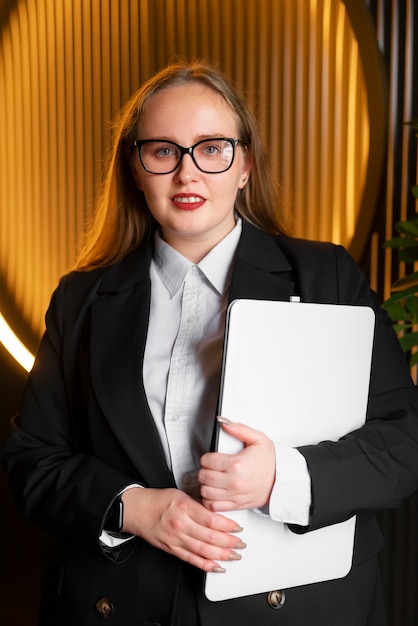 Free Photo professional woman in stylish suit at the office with laptop