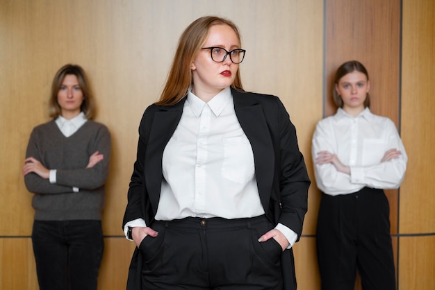 Free photo professional women in stylish suits at the office