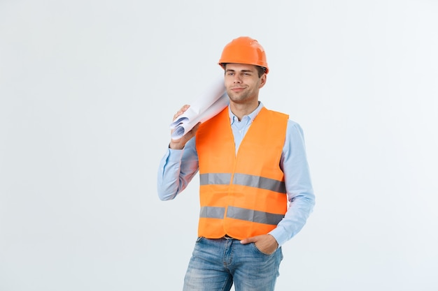 Professional young engineer with blueprint, isolated on white.