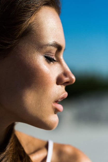 Profile of pretty woman with pink lips