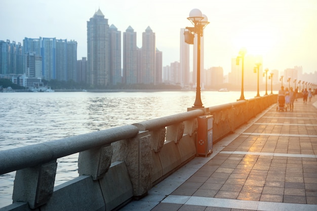 Promenade next to the river with buildings background