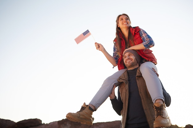 Proud Americans Hiking in Mountains