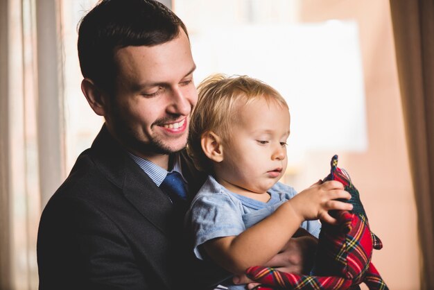 Proud father smiling with his son