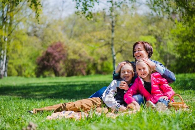 Proud mother with her children outdoors