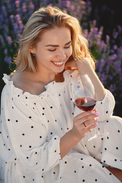 Provence woman relaxing in lavender field. Lady in a picnic.