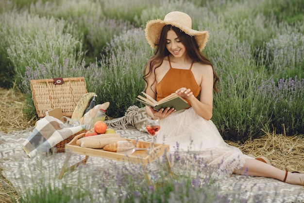 Free Photo provence woman relaxing in lavender field. lady in a picnic.