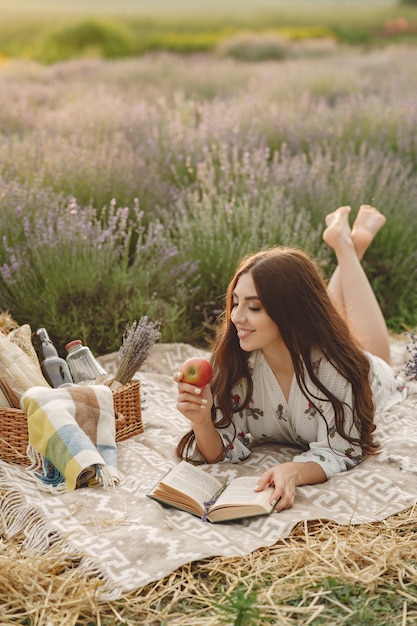 Free Photo provence woman relaxing in lavender field. lady in a picnic.