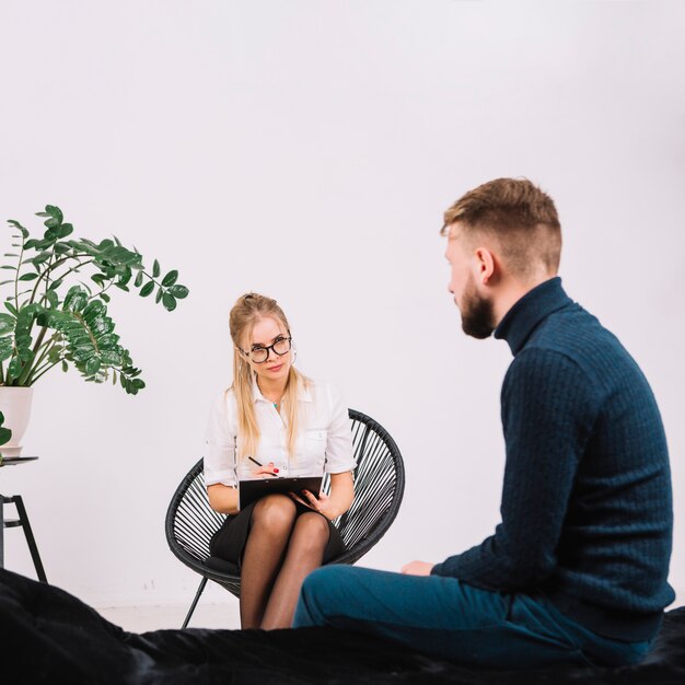 Psychologist having session with her patient in office