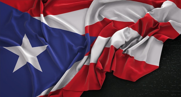 Free photo puerto rico flag wrinkled on dark background 3d render