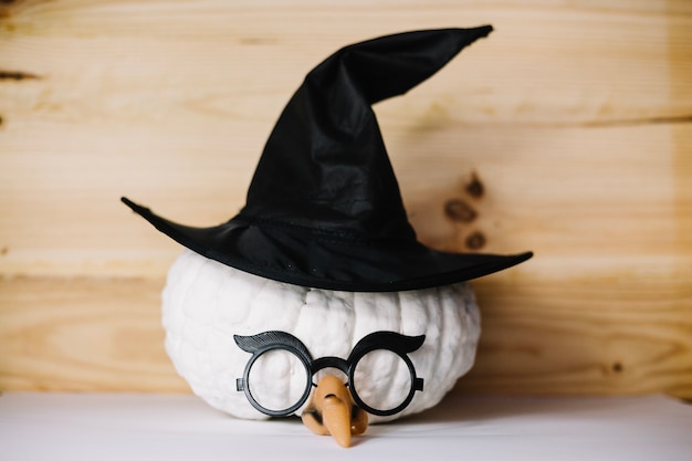 Free Photo pumpkin with witch hat and eyeglasses 