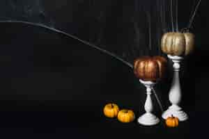 Free photo pumpkins and candles near web