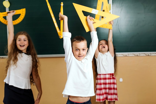 Free Photo pupils with equipment at blackboard