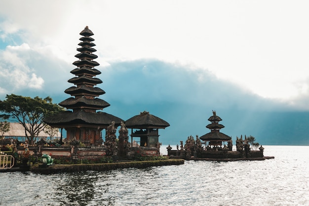 Pura Ulun Danu Bratan, Bali. Hindu temple surrounded by flowers on Bratan lake