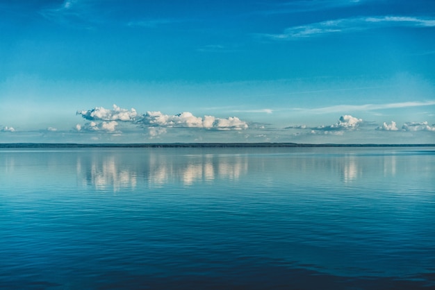 Free Photo pure white clouds of the sky reflected in the water of the sea