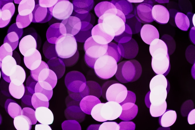 Free photo purple circular neon lights background