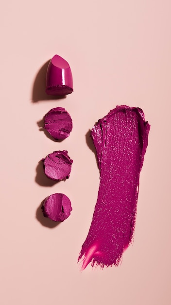 Free Photo purple lipstick shade on pink background