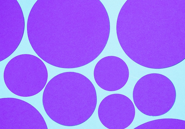 Free photo purple round geometric shape on blue background