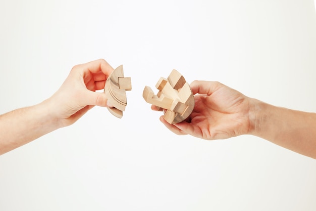 Puzzle in hand isolated on white background