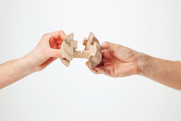 Puzzle in hand isolated on white