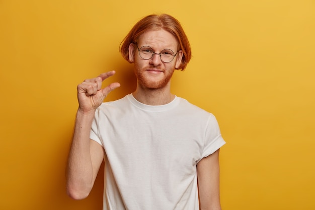 Puzzled displeased ginger guy with bob hairstyle