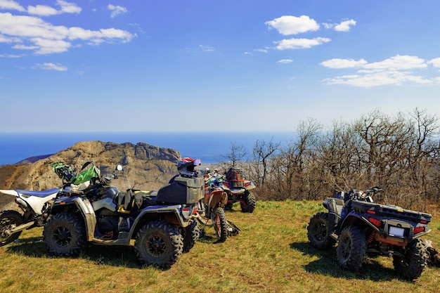 Quad atv cars all terrain vehicle parked on mountain road