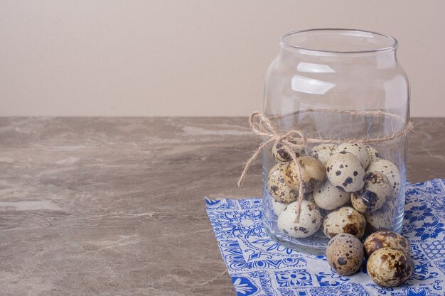 Quail eggs in a glass container jar