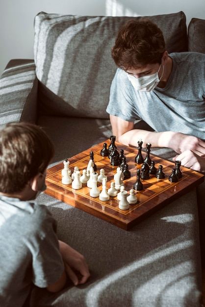 Quarantined boys playing chess