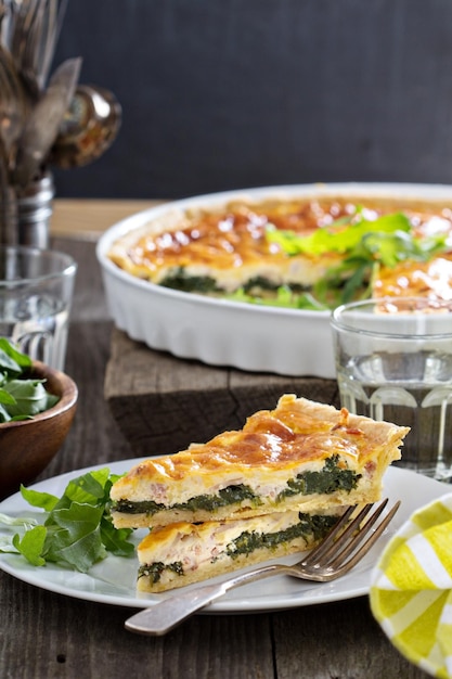 Quiche with arugula and bacon