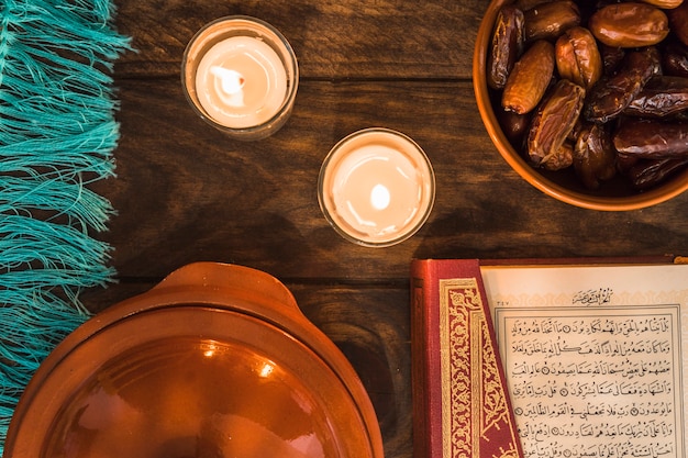 Free photo quran and dates near burning candles