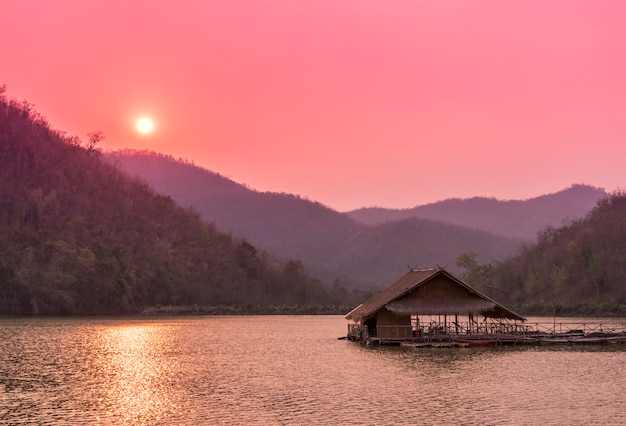 Free Photo raft floating on the river after sunset time