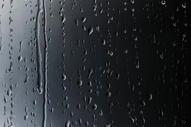 Free photo rain drops on glass textured background