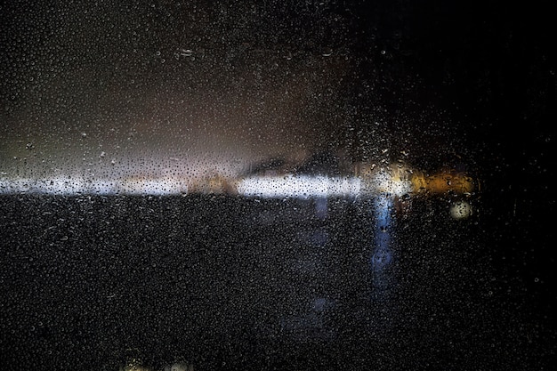 Free Photo rain effect on city night background