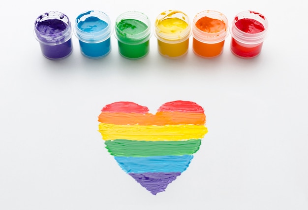 Free photo rainbow containers of paint for pride love and heart