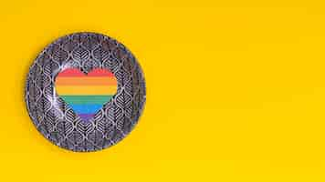 Free photo rainbow heart on painted saucer as sign of lgbt