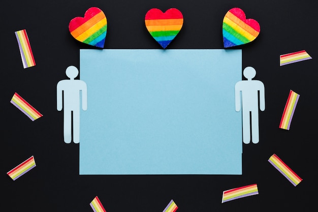 Free photo rainbow hearts with gay couple icons and paper