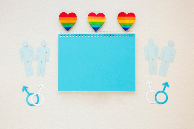 Free photo rainbow hearts with gay couples icons and notepad