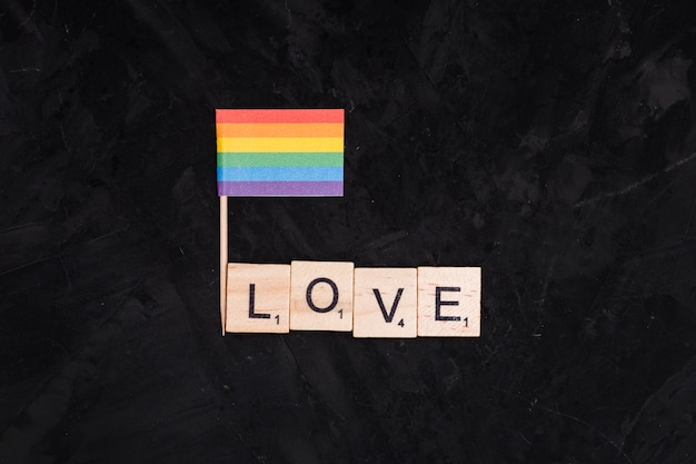 Free photo rainbow lgbt flag and love inscription