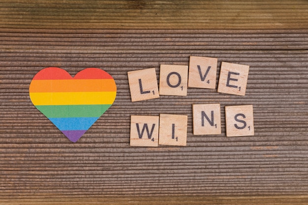 Free photo rainbow lgbt heart with love wins sign