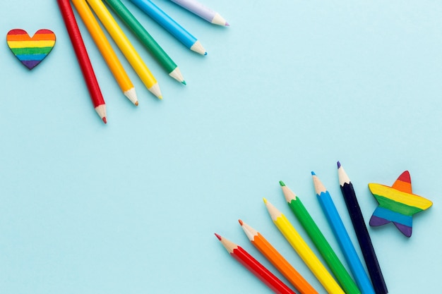 Rainbow pride flag made from pencils copy space