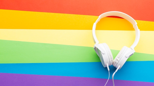 Free Photo rainbow pride flag and white headphones