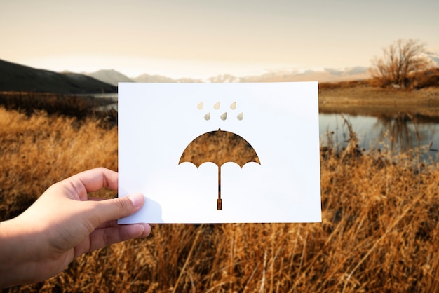 Free photo rainy season perforated paper umbrella