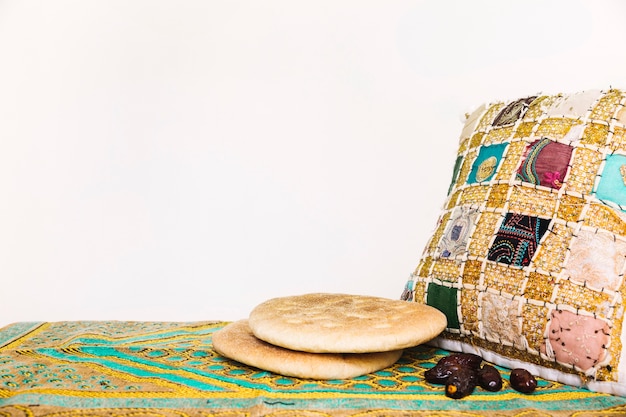 Free photo ramadan concept with arab bread and cushion