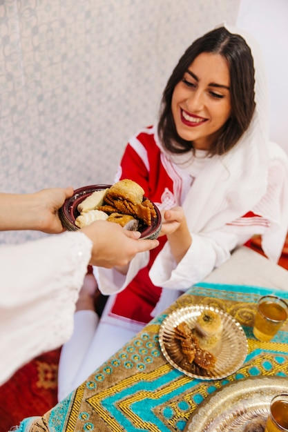 Free Photo ramadan concept with woman receiving food