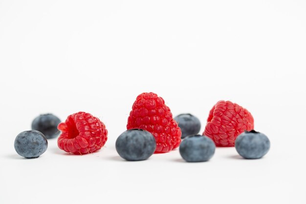 Raspberries and blueberries isolated