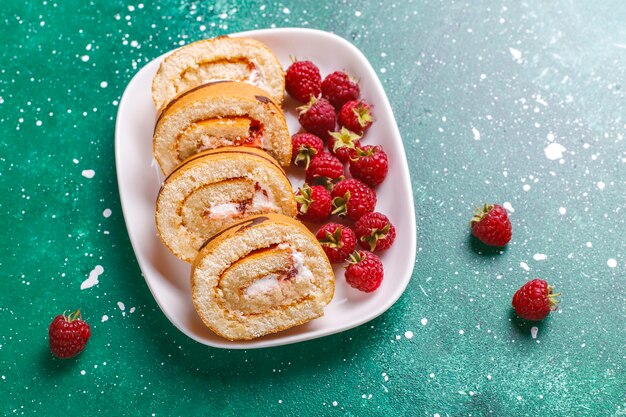 Raspberry cake roll with fresh berries.