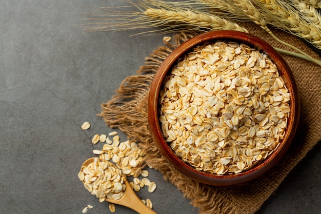 raw barley grain in old dark background