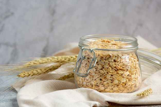 raw barley grain in old dark background