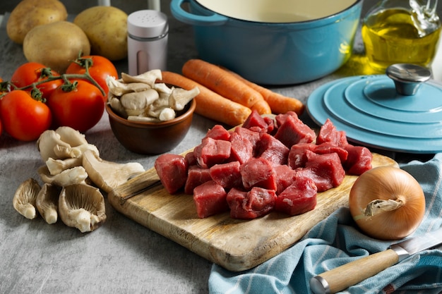 Raw beef on wooden board high angle